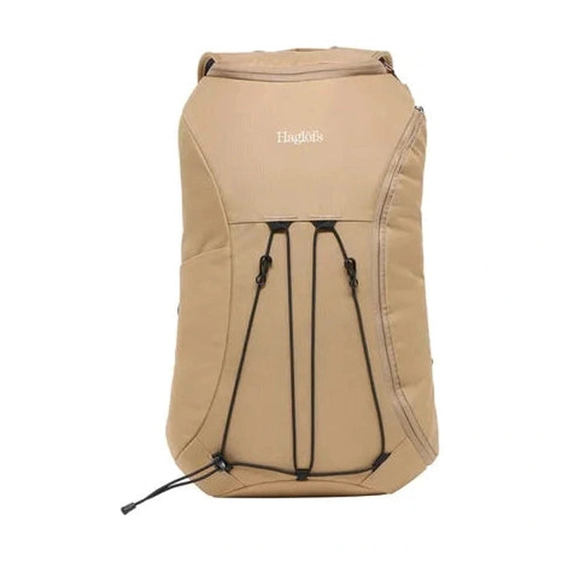 Framsida beige dagryggsäck med Haglöfs-logotyp och system av elastiska snören